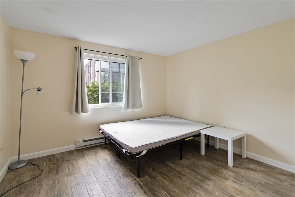 388 Great Road, Unit B14 Acton, MA 01720 - Photo 17 of 24 a room with a table and a window