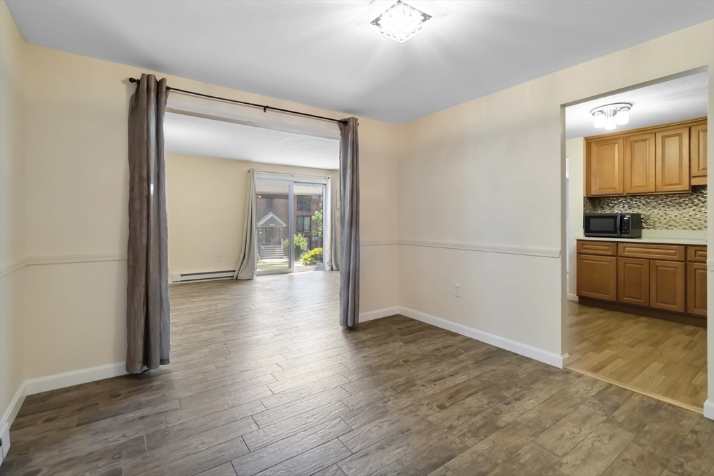 388 Great Road, Unit B14 Acton, MA 01720 - Photo 6 of 24 a view of a house and wooden floor