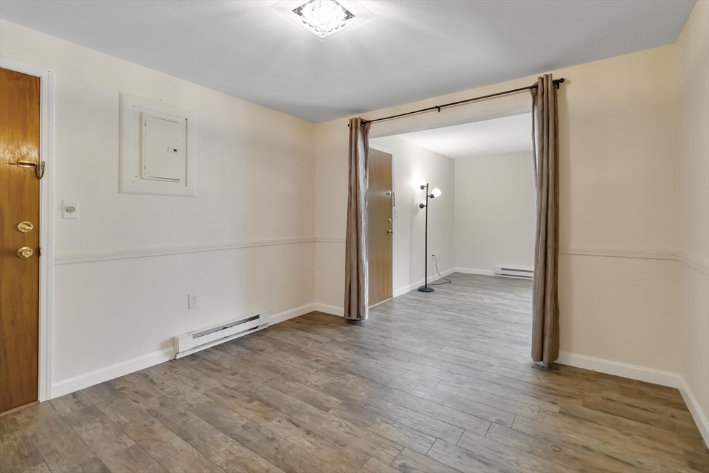 388 Great Road, Unit B14 Acton, MA 01720 - Photo 7 of 24 wooden floor in an empty room