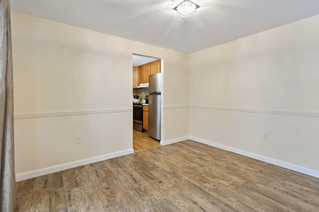 388 Great Road, Unit B14 Acton, MA 01720 - Photo 8 of 24 a view of empty room with wooden floor