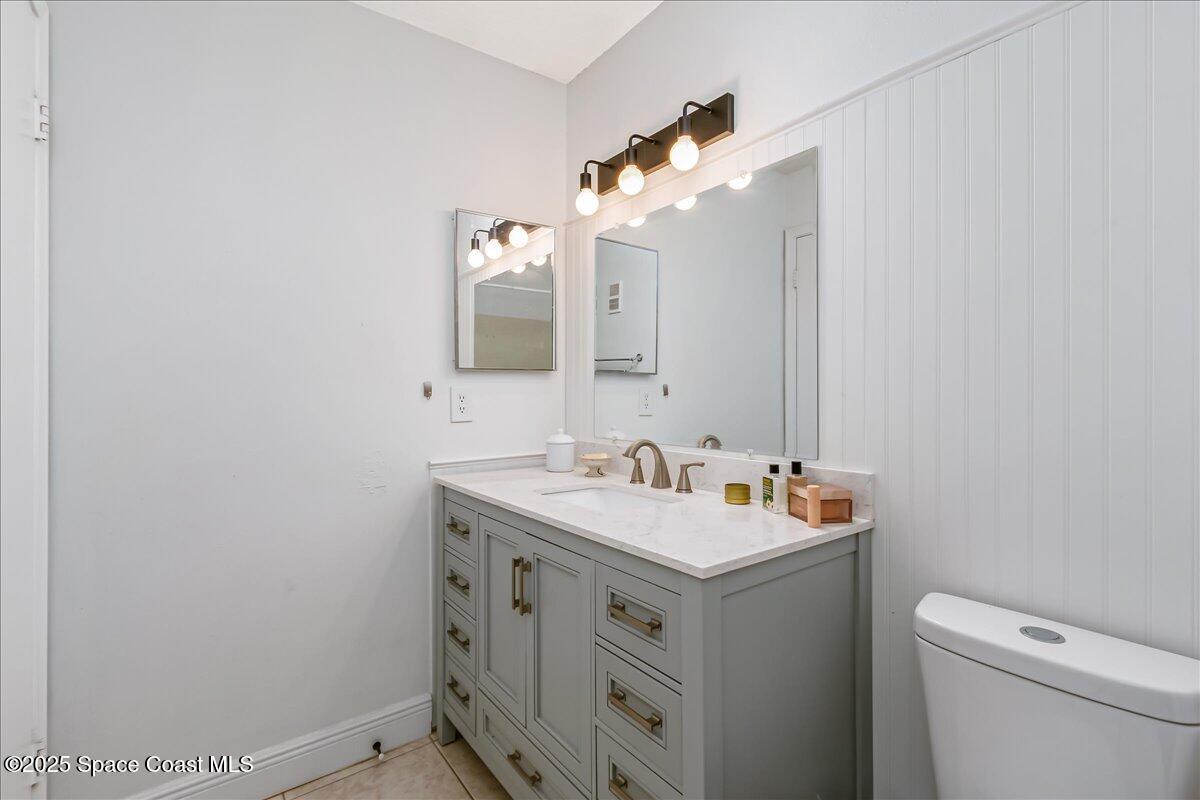 7667 North Wickham Road, Unit 118 Melbourne, FL 32940 - Photo 10 of 23 a bathroom with a sink and a toilet