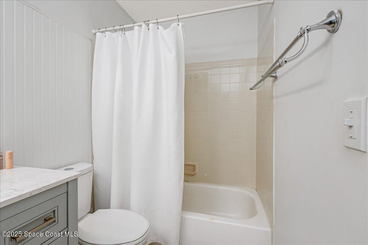 7667 North Wickham Road, Unit 118 Melbourne, FL 32940 - Photo 11 of 23 a bathroom with a sink toilet and shower