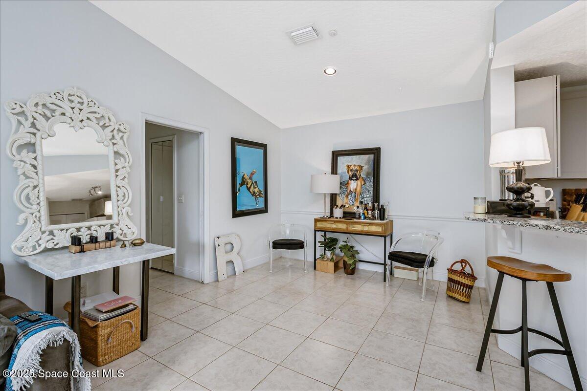 7667 North Wickham Road, Unit 118 Melbourne, FL 32940 - Photo 8 of 23 a living room with furniture and a table