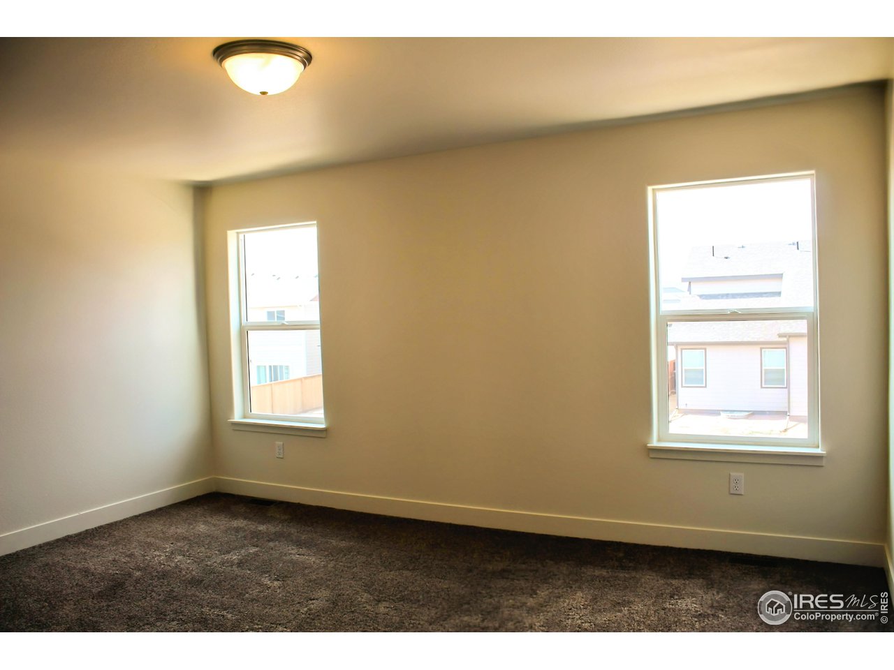 434 Luminous Drive Windsor, CO 80550 - Photo 14 of 29 a view of an empty room with a window