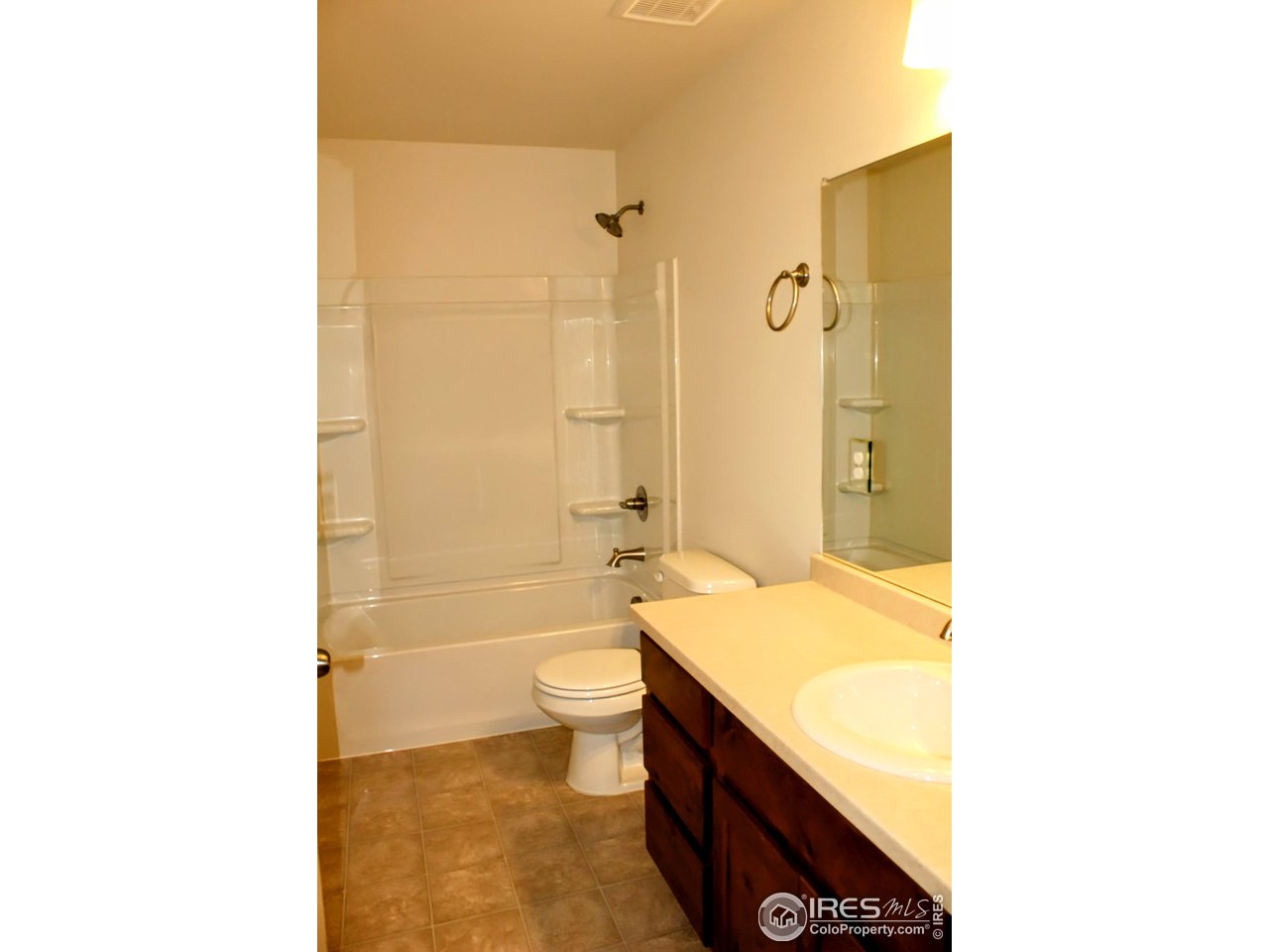 434 Luminous Drive Windsor, CO 80550 - Photo 19 of 29 a bathroom with a sink a toilet and shower