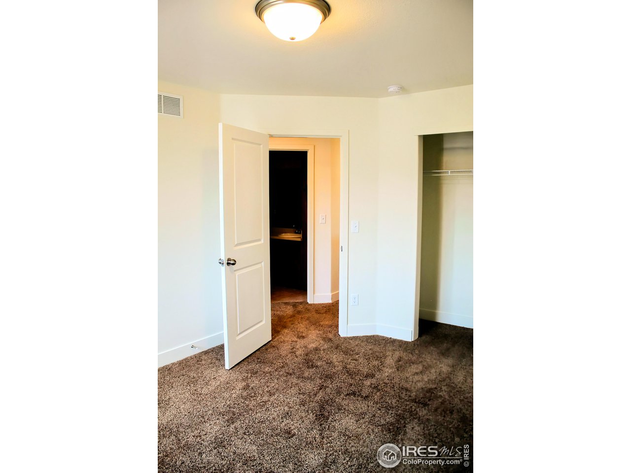 434 Luminous Drive Windsor, CO 80550 - Photo 22 of 29 a view of a room with a hallway