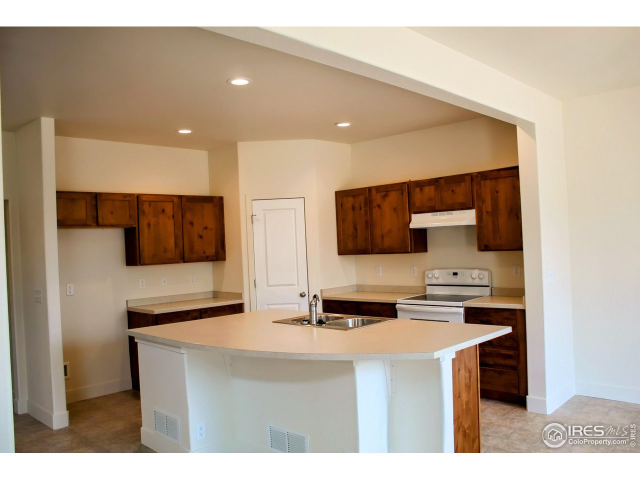 434 Luminous Drive Windsor, CO 80550 - Photo 8 of 29 a kitchen with kitchen island a sink stainless steel appliances and cabinets