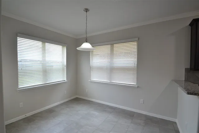 a view of an empty room with windows