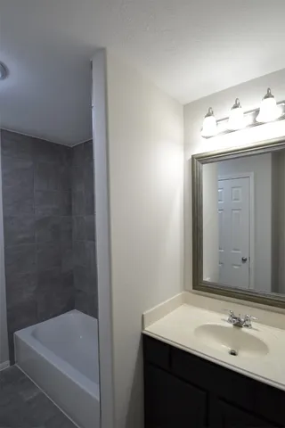 a bathroom with a sink and a bathtub