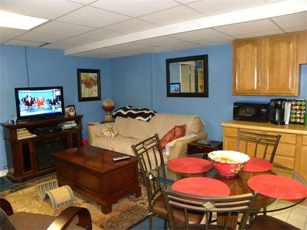 12 Lincoln Point Road Charlton, MA 01507 - Photo 16 of 30 a living room with furniture and a flat screen tv
