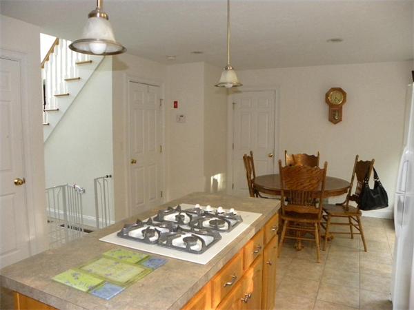 12 Lincoln Point Road Charlton, MA 01507 - Photo 19 of 30 a kitchen with a table and chairs