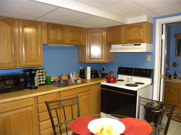 12 Lincoln Point Road Charlton, MA 01507 - Photo 23 of 30 a kitchen with a sink stove and cabinets