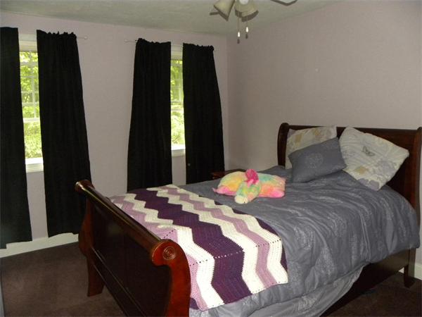12 Lincoln Point Road Charlton, MA 01507 - Photo 26 of 30 a bedroom with bed and mirror