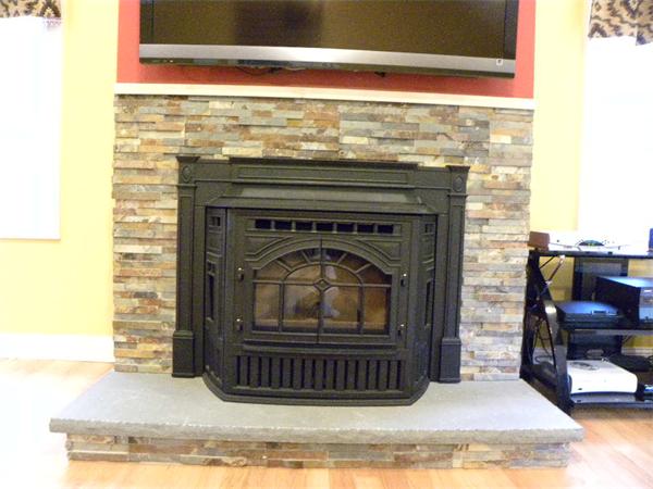 12 Lincoln Point Road Charlton, MA 01507 - Photo 28 of 30 a living room with a fireplace windows and a rug