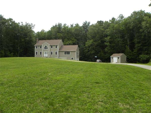 12 Lincoln Point Road Charlton, MA 01507 - Photo 30 of 30 a front view of a house with a yard