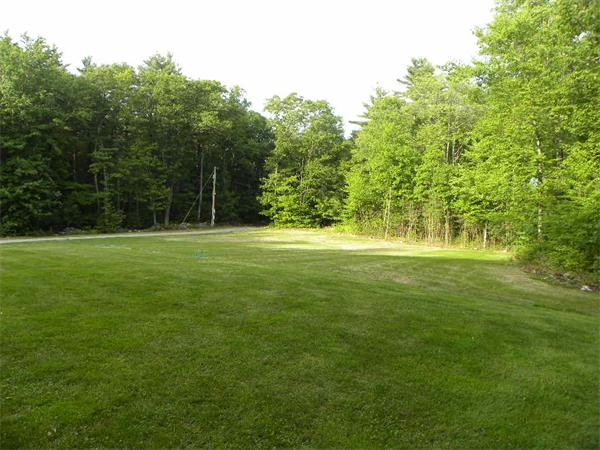 12 Lincoln Point Road Charlton, MA 01507 - Photo 3 of 30 a view of a field with trees in the background