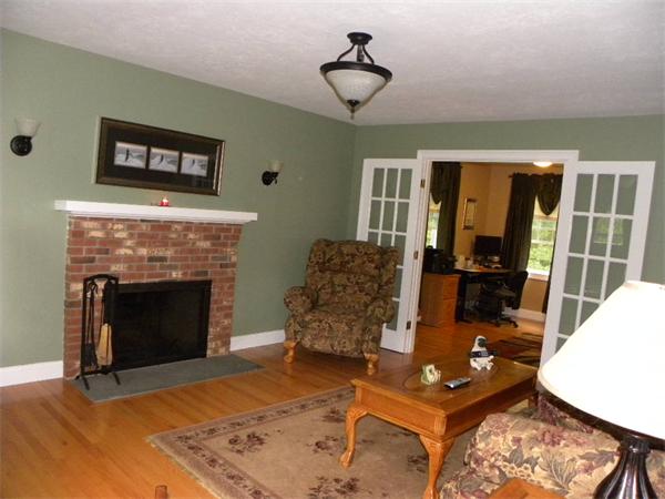 12 Lincoln Point Road Charlton, MA 01507 - Photo 7 of 30 a living room with furniture and a fireplace