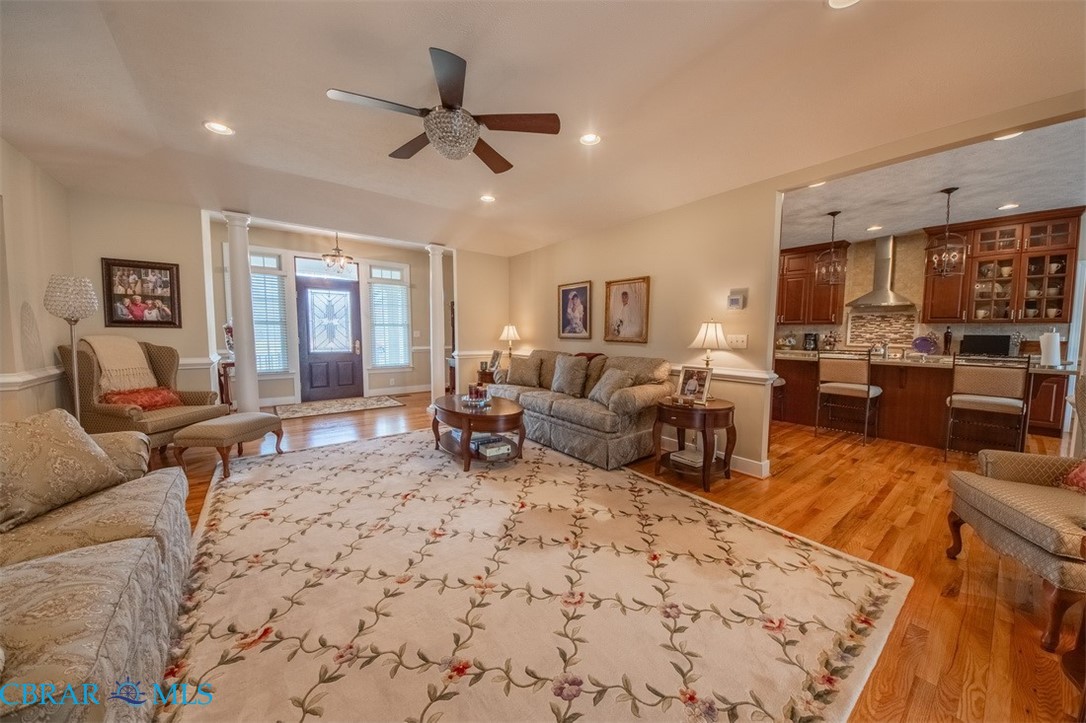 120 North Shore Road Locust Hill, VA 23092 - Photo 32 of 39 Living area featuring ornate columns, light wood-style floors, a ceiling fan, and recessed lighting