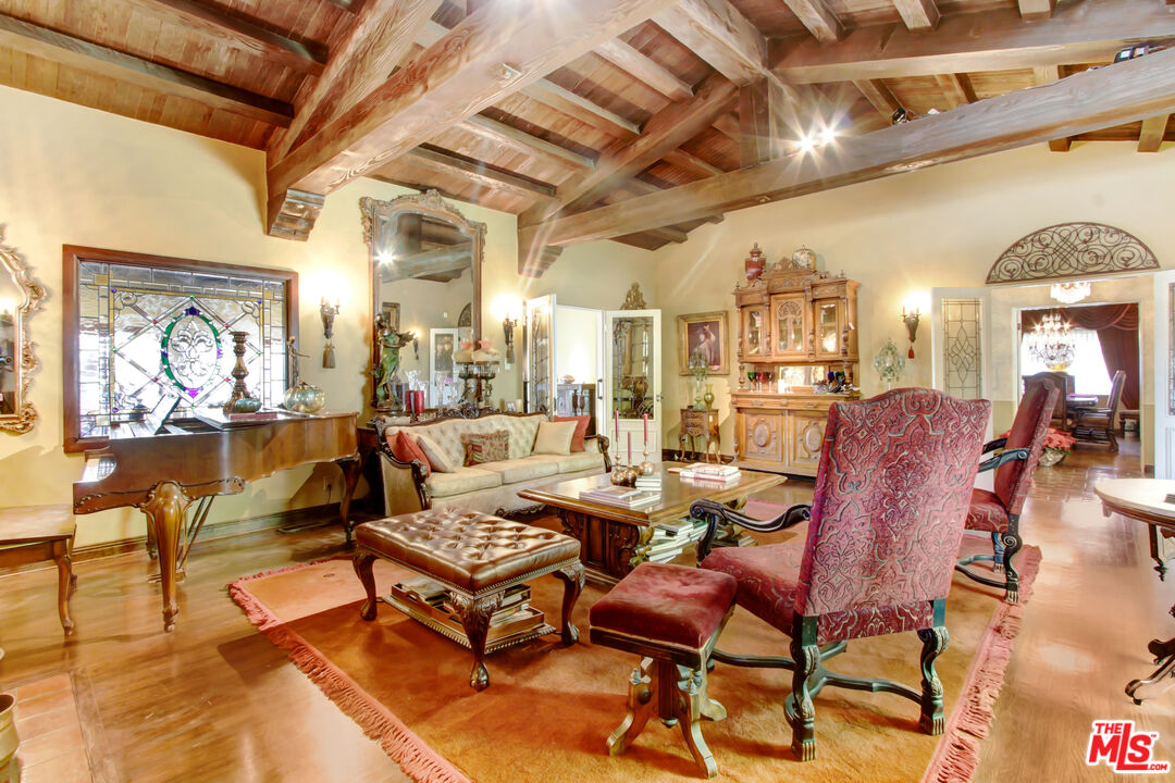 303 Armsley Square Ontario, CA 91762 - Photo 3 of 13 a living room with lots of furniture and a chandelier