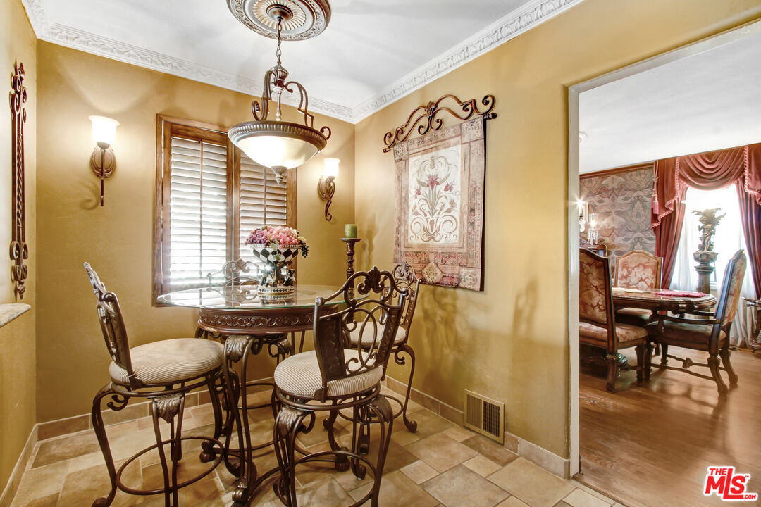 303 Armsley Square Ontario, CA 91762 - Photo 7 of 13 a dining room with furniture and window