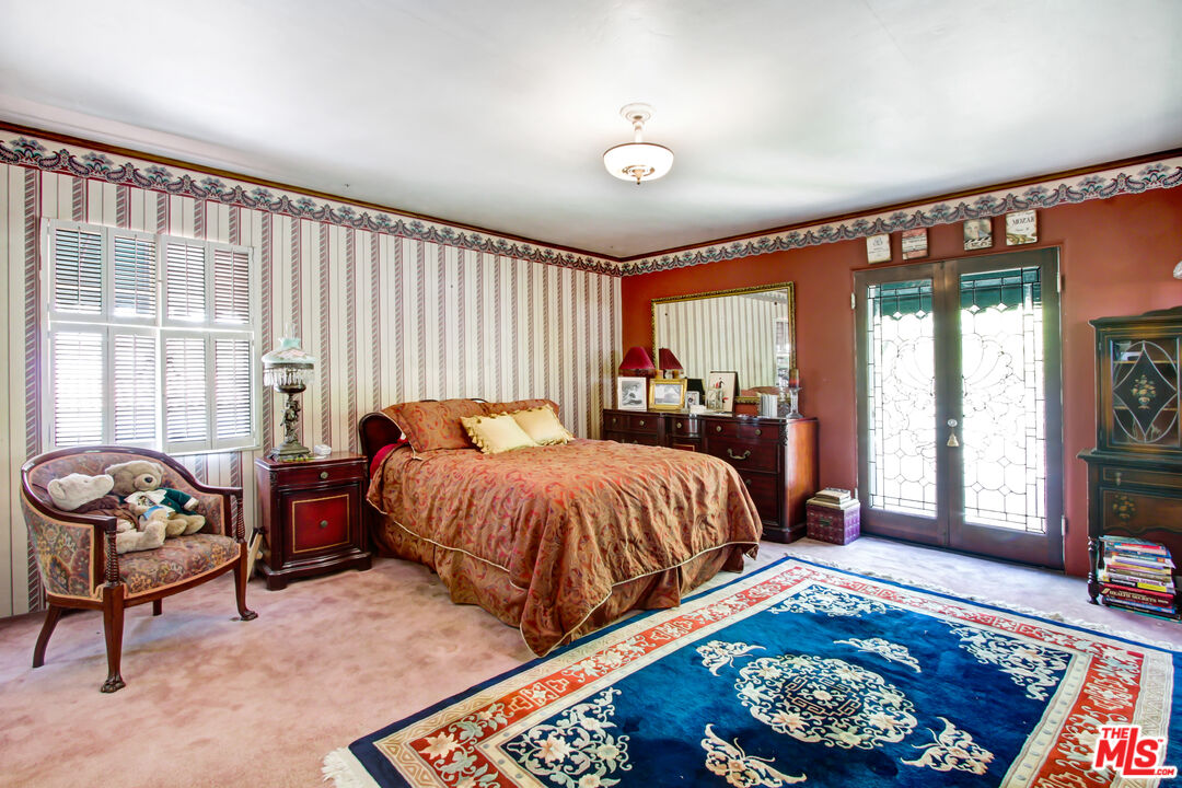 303 Armsley Square Ontario, CA 91762 - Photo 10 of 13 a bedroom with a bed and wooden floor