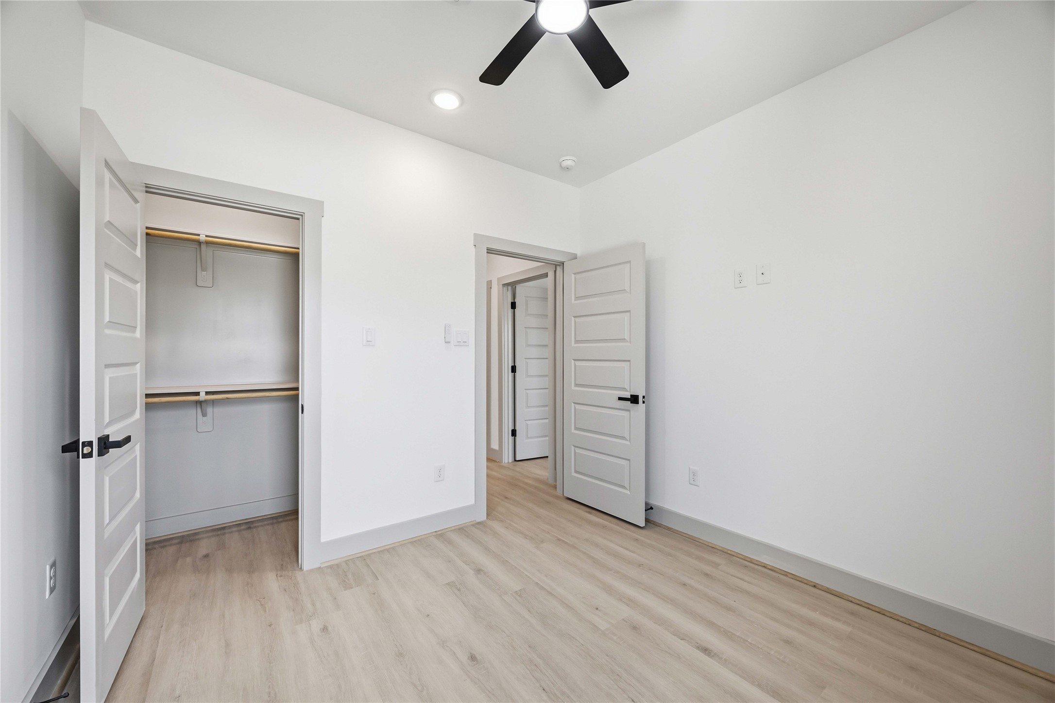 7555 Calhoun Road, Unit A/B Houston, TX 77033 - Photo 21 of 27 an empty room with closet and a ceiling fan