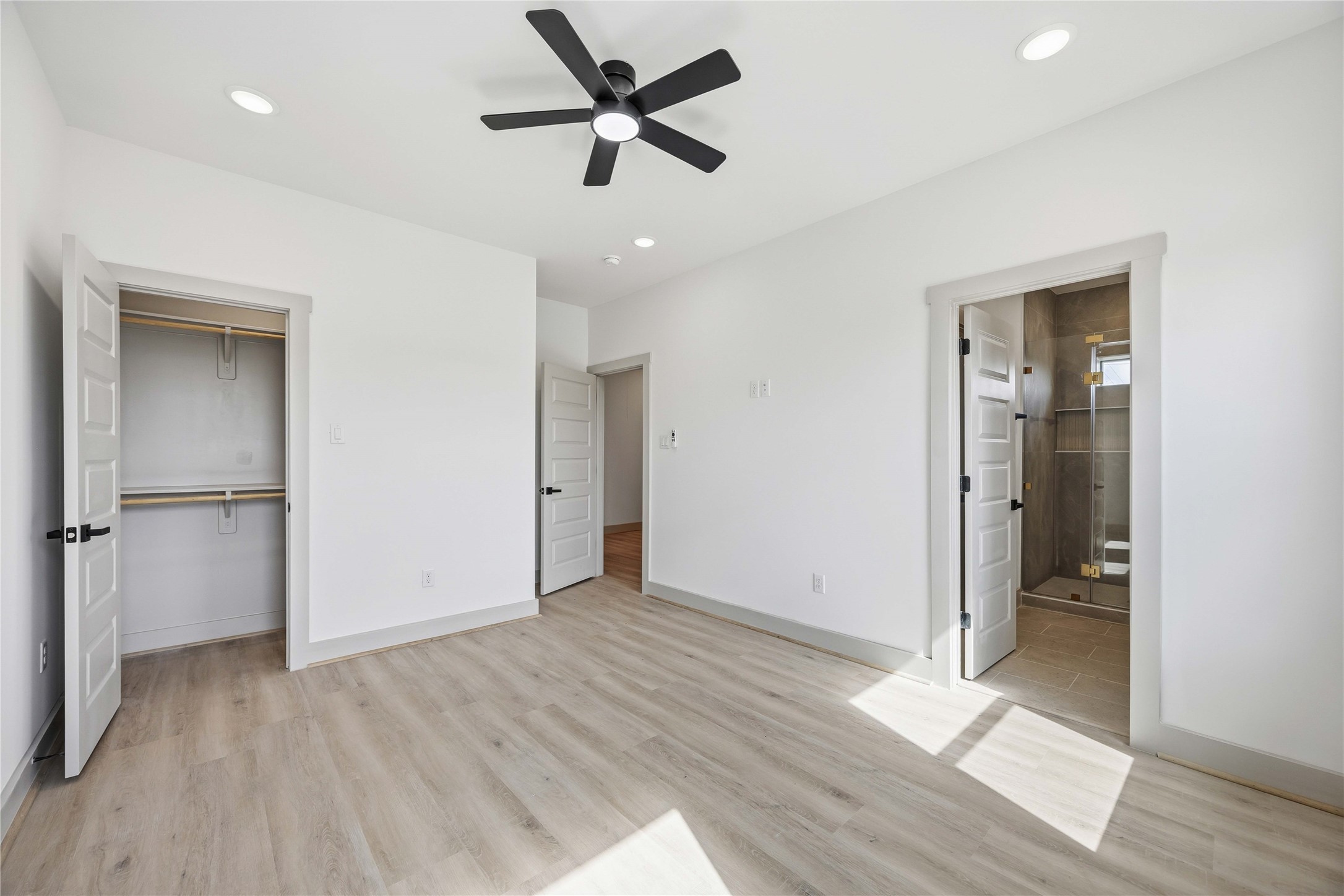 7555 Calhoun Road, Unit A/B Houston, TX 77033 - Photo 24 of 27 wooden floor in an empty room with a window
