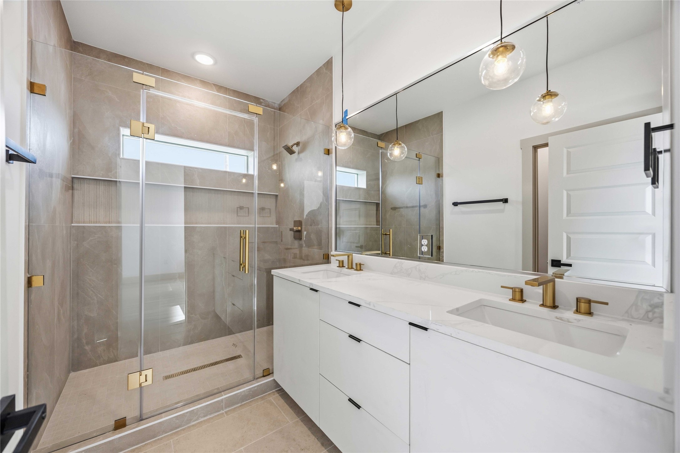 7555 Calhoun Road, Unit A/B Houston, TX 77033 - Photo 25 of 27 a bathroom with a double vanity sink mirror and shower