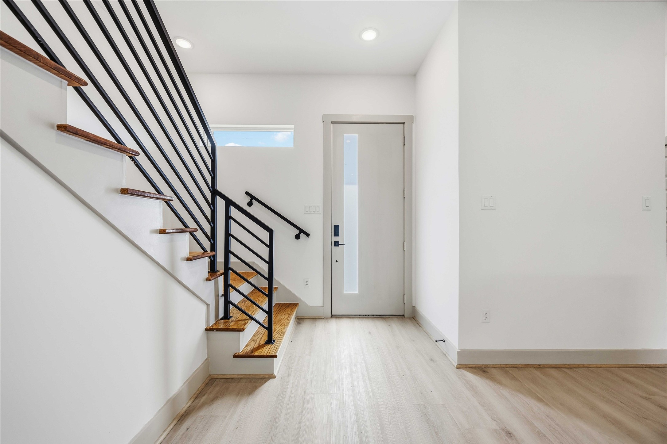 7555 Calhoun Road, Unit A/B Houston, TX 77033 - Photo 4 of 27 an entryway in a hall with wooden floor