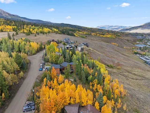 an aerial view of beach and residential houses with outdoor space