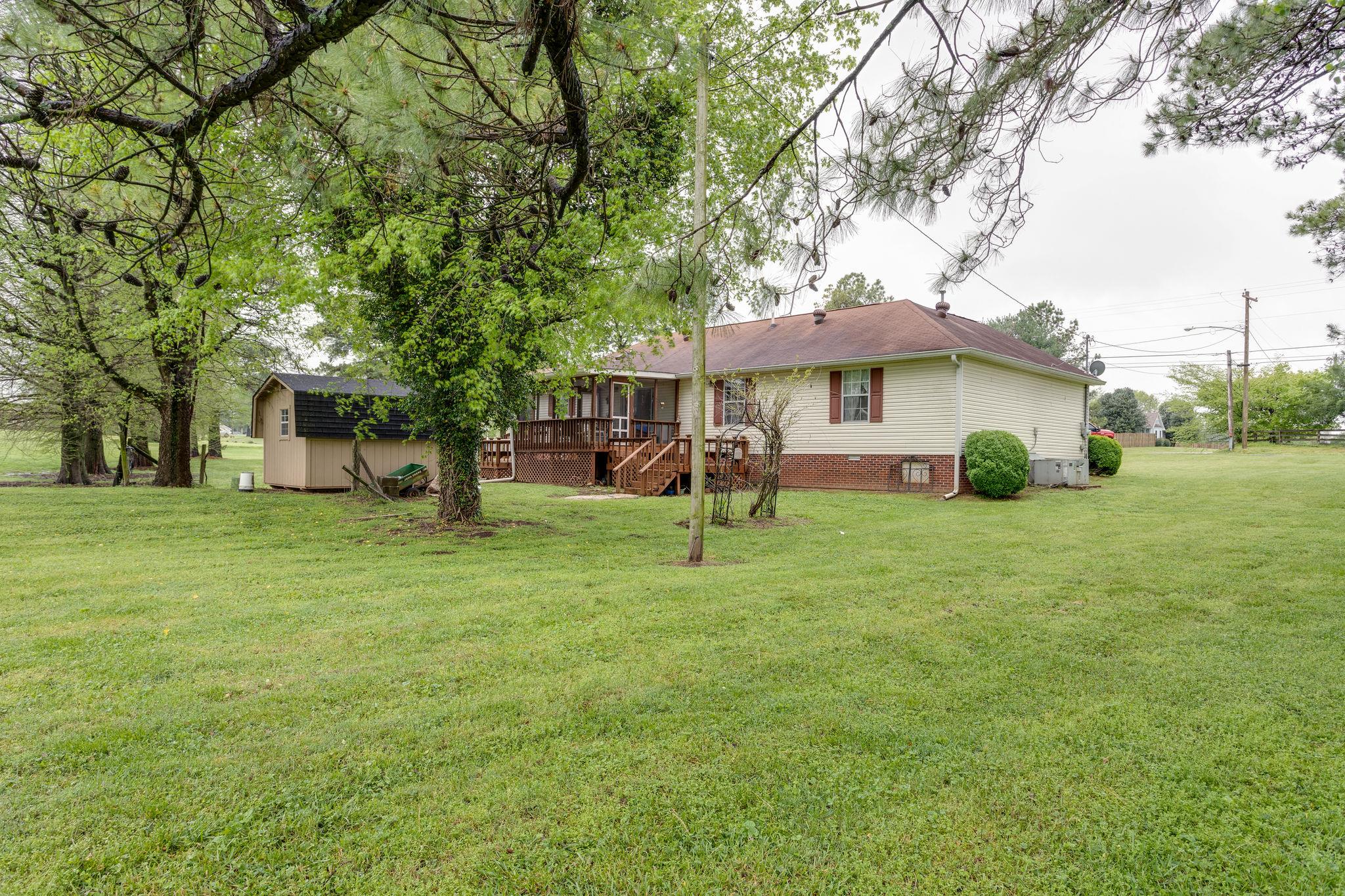 402 Canaan Road Columbia, TN 38401 - Photo 14 of 16 Enjoy the Back Yard from the Screened-In Deck with Sunning Decks