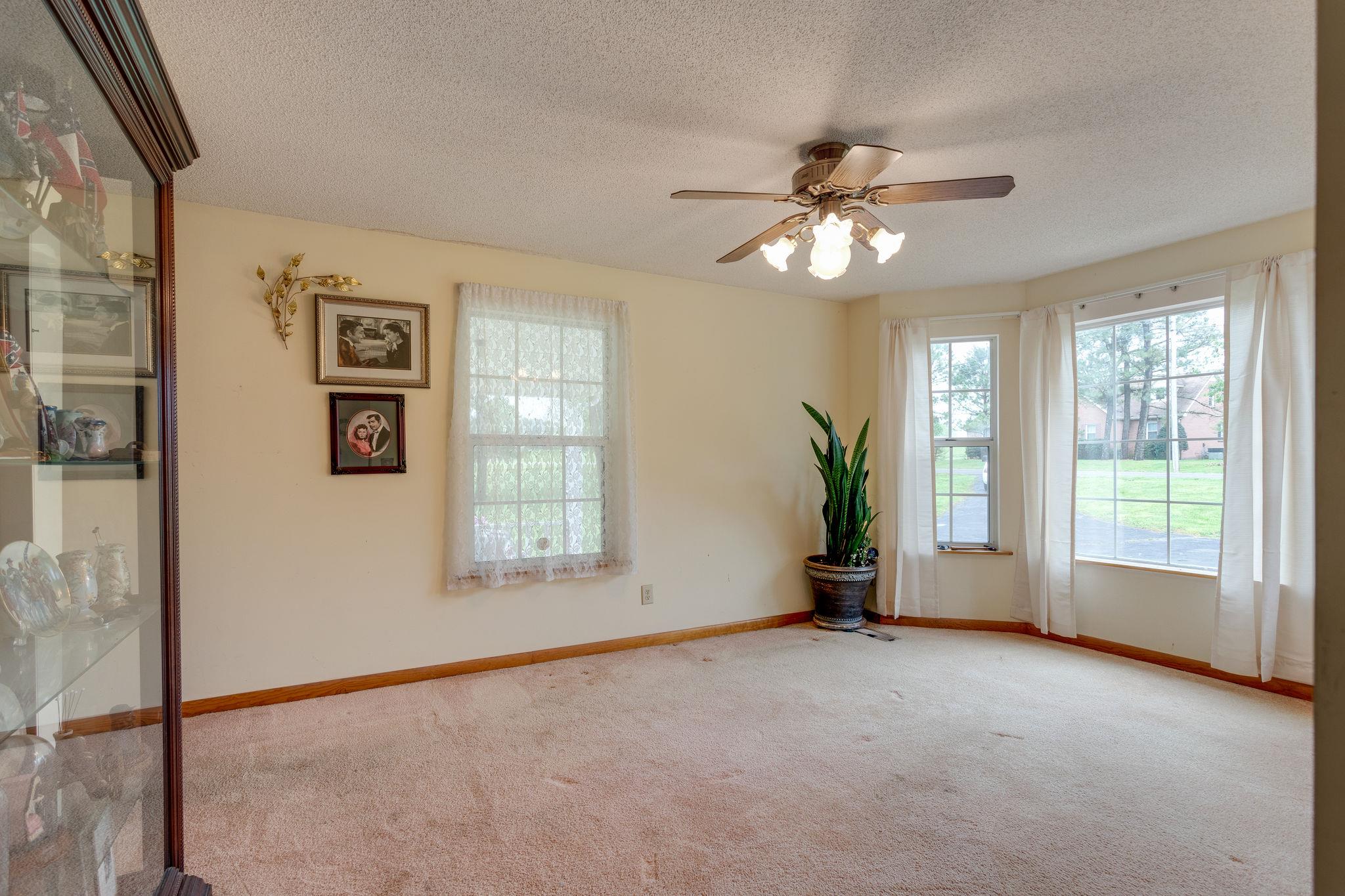 402 Canaan Road Columbia, TN 38401 - Photo 9 of 16 Formal Dining Room with Carpeted Flooring & Ceiling Fan.