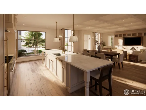 a kitchen with a table chairs and flat screen tv
