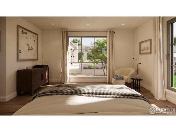 a living room with a bed furniture and a large window