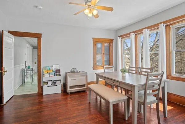 a view of a dining room with furniture window and wooden floor