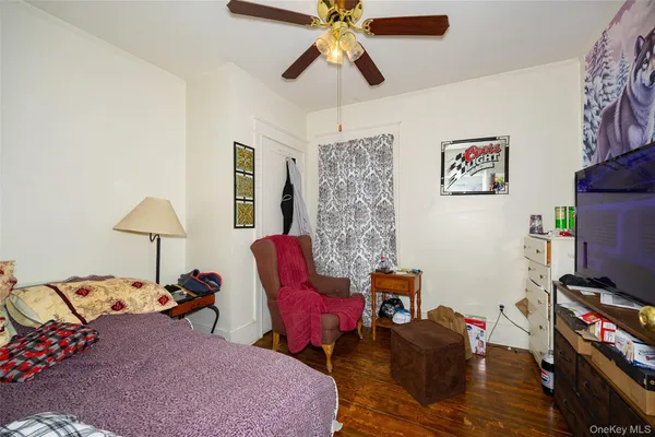 a bedroom with furniture and a chandelier