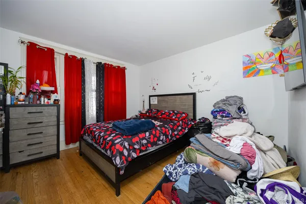 a bedroom with a bed that has a blanket and a blanket