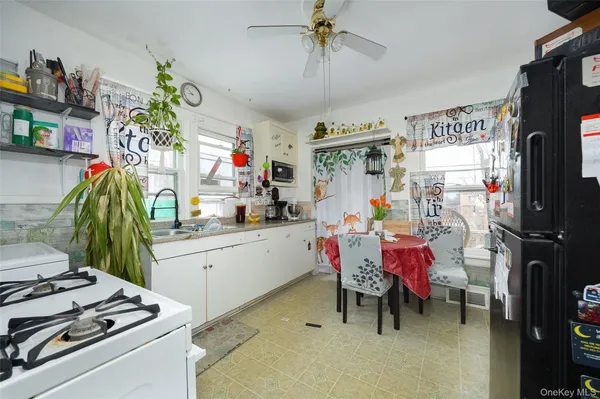 a storage room with furniture and a chandelier