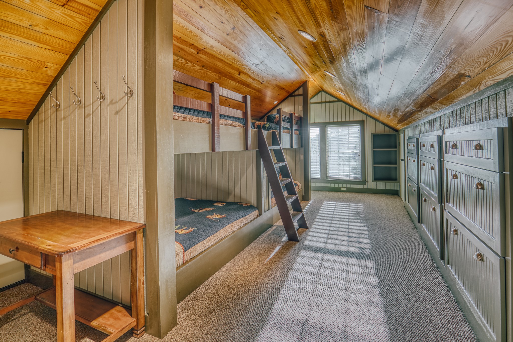1034 Hilbun Road New Ulm, TX 78950 - Photo 42 of 49 Charming built-in bunk accommodations with extensive custom storage and thoughtful design create a fun and functional space for hosting family and guests.