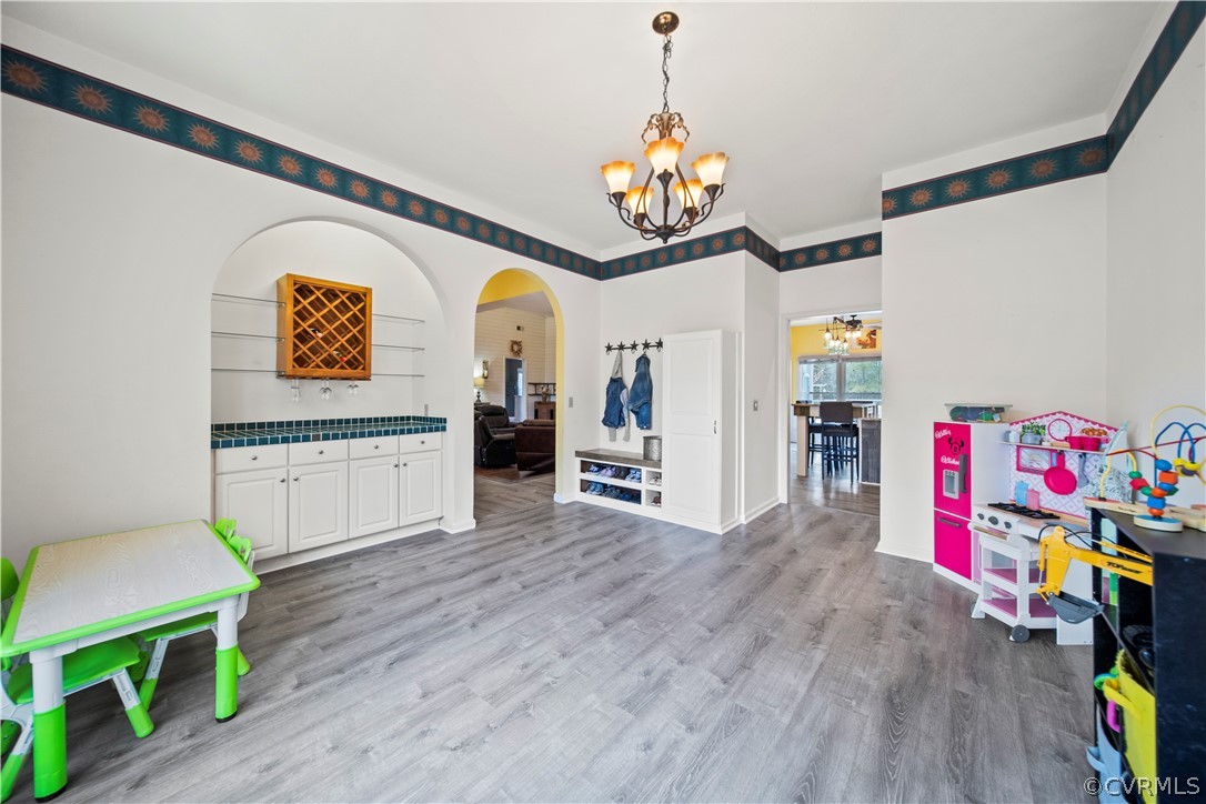 12700 Coalboro Road Chesterfield, VA 23838 - Photo 12 of 50 a view of a dining room with furniture and wooden floor
