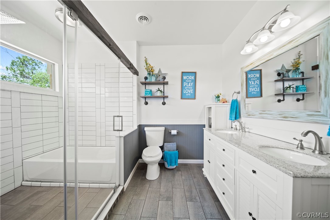 12700 Coalboro Road Chesterfield, VA 23838 - Photo 16 of 50 a bathroom with a sink a toilet and shower