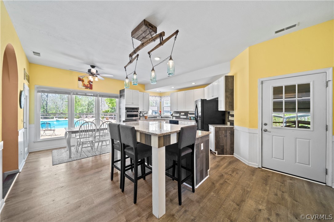12700 Coalboro Road Chesterfield, VA 23838 - Photo 19 of 50 a dining room with furniture window and wooden floor
