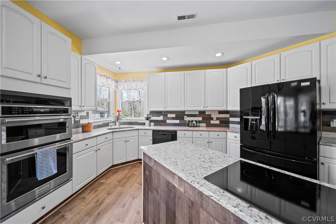 12700 Coalboro Road Chesterfield, VA 23838 - Photo 21 of 50 a kitchen with a refrigerator stove and sink