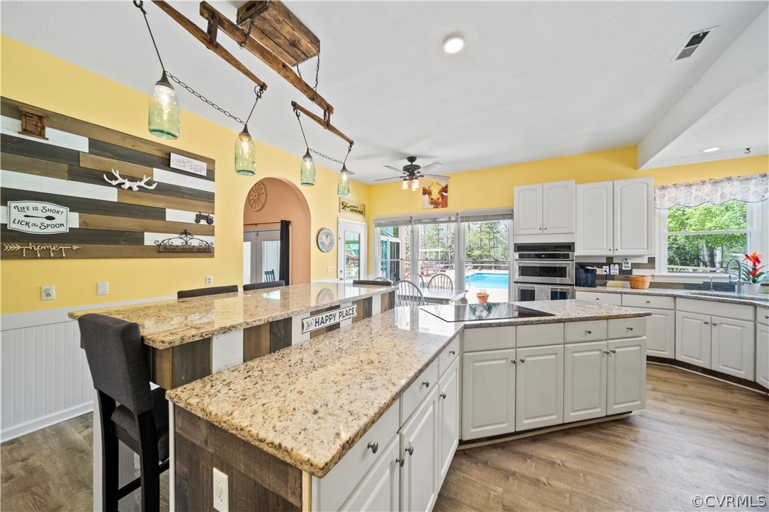 12700 Coalboro Road Chesterfield, VA 23838 - Photo 23 of 50 a large kitchen with a table and chairs in it