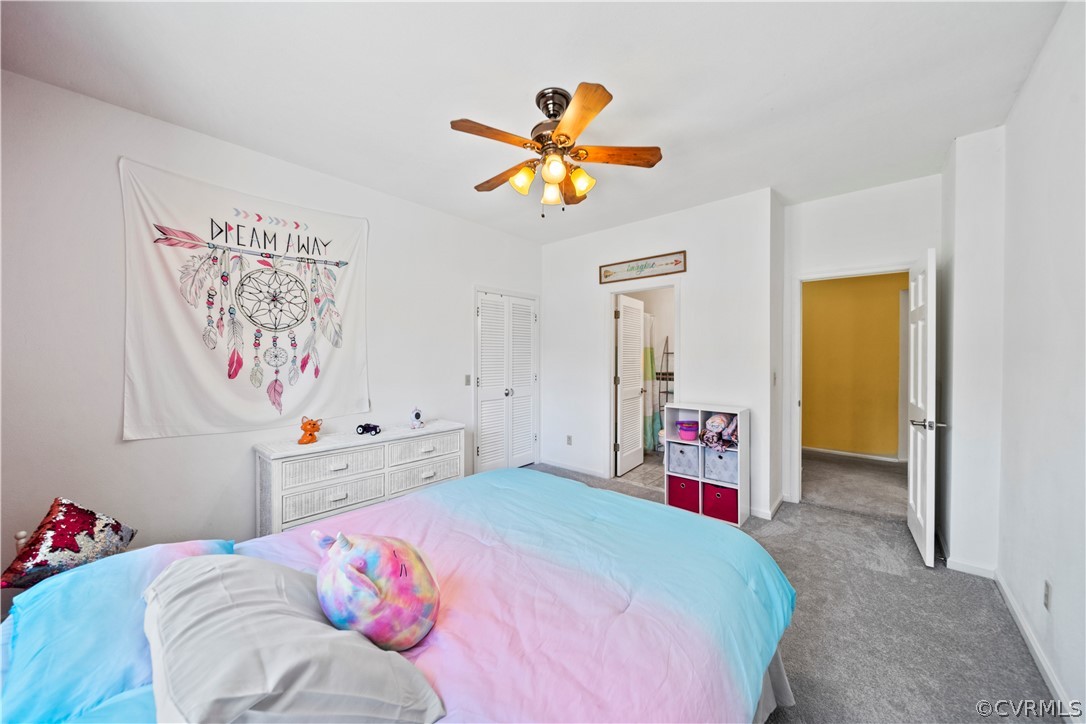 12700 Coalboro Road Chesterfield, VA 23838 - Photo 24 of 50 a bedroom with a bed and a chandelier