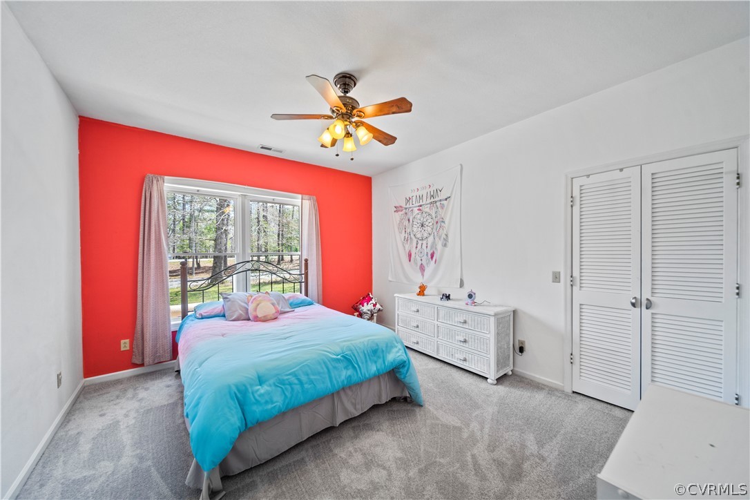 12700 Coalboro Road Chesterfield, VA 23838 - Photo 25 of 50 a bedroom with a bed and a chandelier