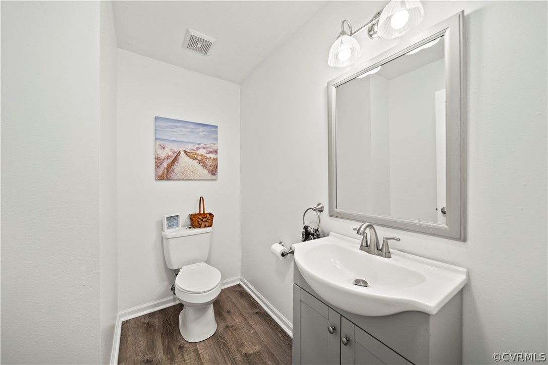 12700 Coalboro Road Chesterfield, VA 23838 - Photo 27 of 50 a bathroom with a toilet a sink and a mirror