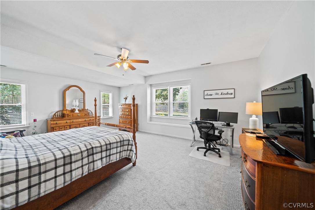 12700 Coalboro Road Chesterfield, VA 23838 - Photo 29 of 50 a bedroom with a bed and a flat screen tv