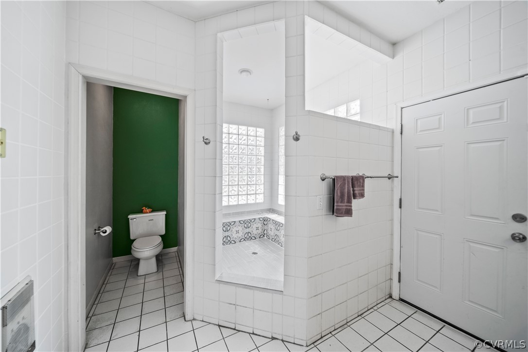 12700 Coalboro Road Chesterfield, VA 23838 - Photo 31 of 50 a bathroom with a bathtub and a shower