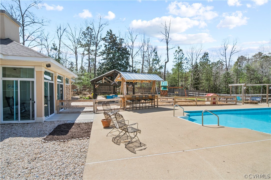 12700 Coalboro Road Chesterfield, VA 23838 - Photo 40 of 50 a view of a swimming pool with lounge chairs